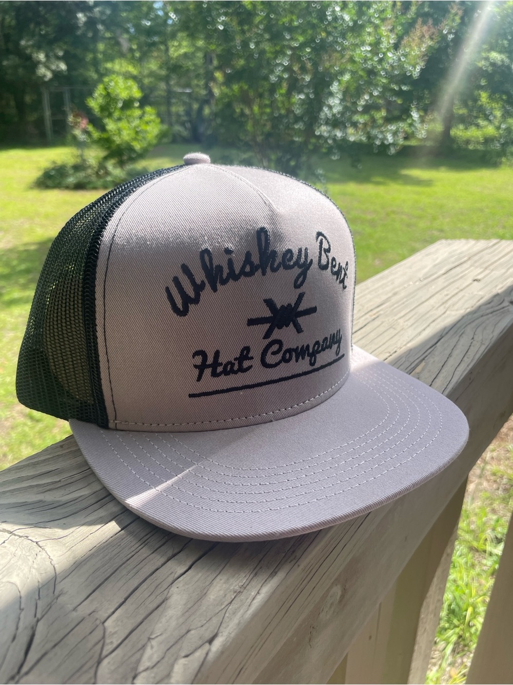 Whiskey Bent Hat Company grey and black trucker hat